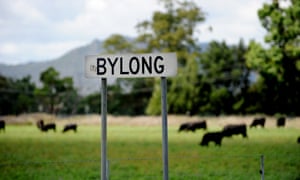 Bylong sign and green field with cows