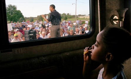 Barack Obama campaigning for the US Senate in 2004, watched by daughter Malia