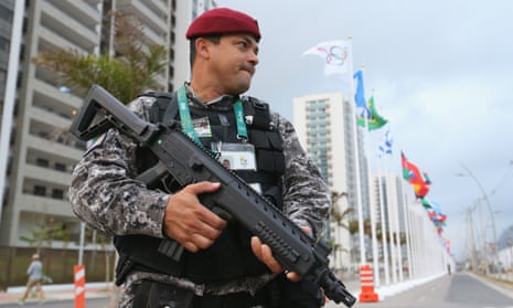 An armed police officer at the Olympic village in Rio close to where a man reported to be a diplomat fought off two muggers on Thursday.