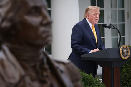 Donald Trump in the Rose Garden, next to a statue of George Washington, at the White House in Washington DC on 24 August.