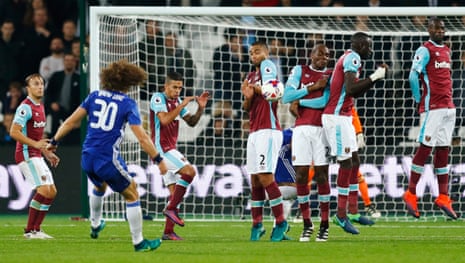 Chelsea’s David Luiz’s freekick only finds the wall.