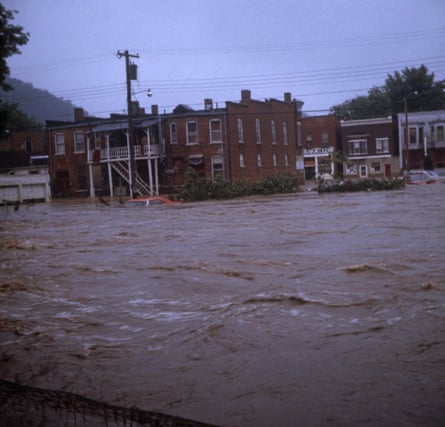 Buildings surrounded by floodwaters.
