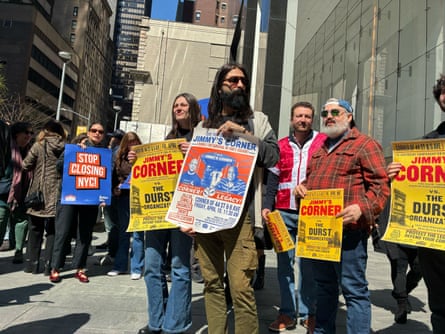 A group of people holding signs.