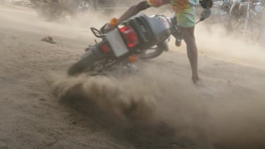 Karimah Ashadu, Machine Boys (2024) Ashadu’s short film explores the informal economy of motorcycle taxis; colloquially known as “Okada”, in the mega city of Lagos. Banned due to the government’s inability to regulate it, Machine Boys portrays a hardy group of bikers who continue this work, seeking to attain financial autonomy and independence. Machine Boys dwells on the consequences of this ban, meanwhile portraying the daily rituals and challenges faced by Okada riders.