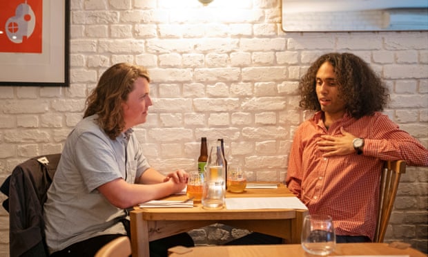 Dining across the divide: ‘He supports a new Heathrow runway – we should invest in trains’ 5 Jasper and Miles sitting at a restaurant table against a white-painted brick wall