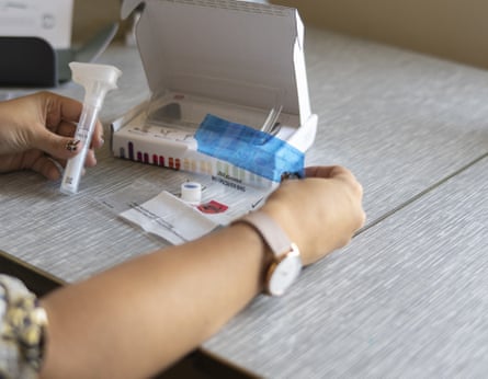 a person holding a DNA test kit