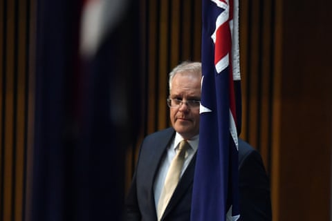 Australia’s prime minister, Scott Morrison, arrives at coronavirus a press conference.