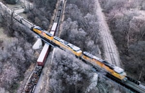 Wisconsin, US: freight train passes over parked carriages in Janesville