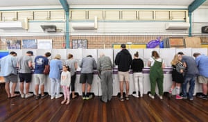 Voters go into the polling box.