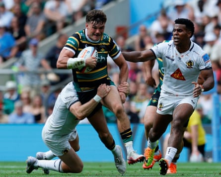 The Northampton captain, George Furbank, charges through an Exeter tackle during the Prem final