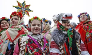 Ukrainian children in traditional dress at the star of Bethlehem procession Sophia Square, Kiev.
