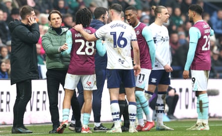 Burnley and Preston players mill about on the sidelines