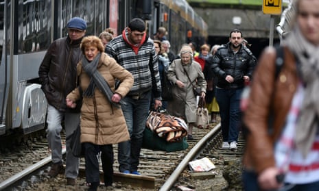 People evacuate a tram during an anti-terrorist operation in Brussels on Friday.