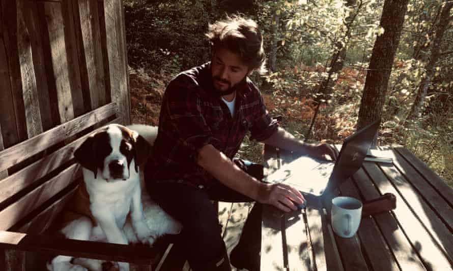 Will Dean, with Bernie the St Bernard, at his home in Sweden.