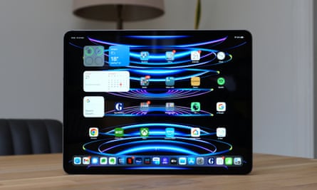 iPad Pro displays a normal home screen with app icons.