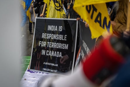 A protester holds a sign ‘India is responsible for Terrorism in Canada.