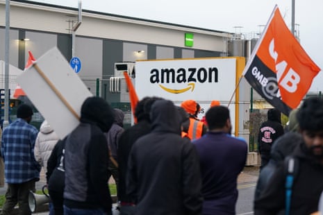 Amazon staff members on a GMB union picket line outside the online retailer's site in Coventry