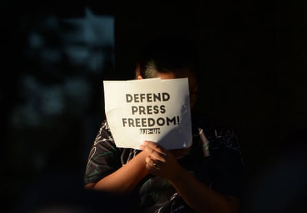 A student holds a placard during a protest at the state university grounds in Manila this month in support of Maria Ressa.