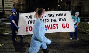 NHS staff demanding stage a protest outside Downing Street in London.