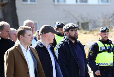 Jimmie Åkesson with other men and two police officers.