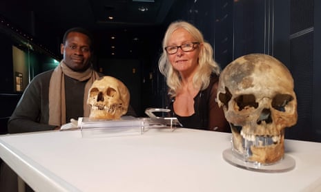 Onyeka Nubia (left) and Alex Hildred with the skulls of ‘Henry’ (background) and the ‘archer royal’