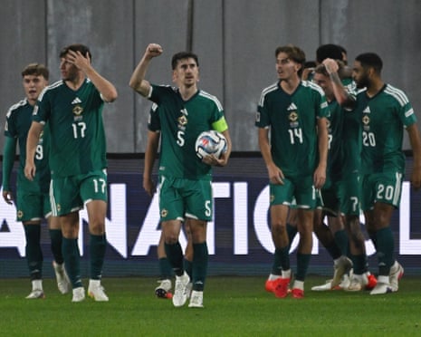 Northern Ireland's Trai Hume celebrates after Shea Charles scored their late winner in Georgia.