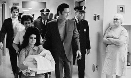 Elvis Presley and his wife, Priscilla, leaving Baptist hospital in Memphis, Tennessee, with their baby daughter, Lisa Marie, in February 1968.