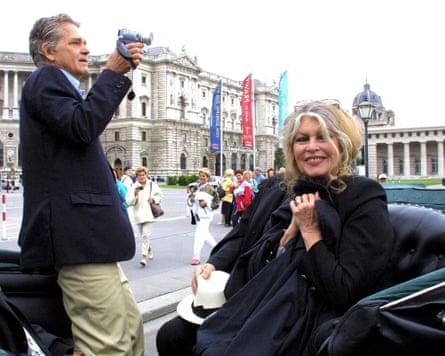 Brigitte Bardot with her husband, Bernard d’Ormale, holding a camera, on a carriage tour through Vienna