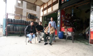 This patriarch (seated, first from right) came to 10th of Ramadan from a village in southern Egypt for employment in the late 1970s. He has owned this garage since 1979 and the sons are now responsible for managing the business.