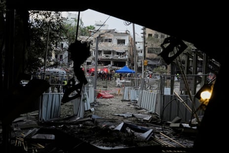 Rescue team work at the site where a missile launched from Iran struck Tel Aviv, Israel, Monday, 16 June, 2025.