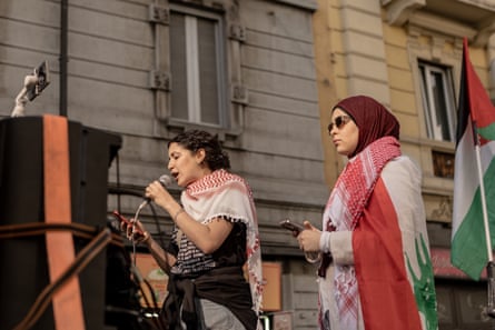 Speakers at an anti-war protest in Milan on 11 April.