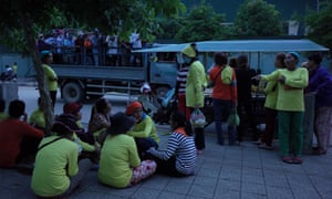 Garment workers on the outskirts of Pnomh Penh prepare for the working day.