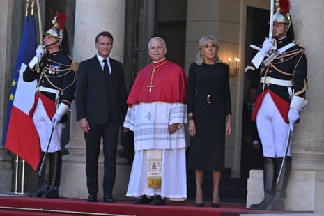 Emmanuel Macron welcomes Pope Leon XIV at the Elysee in Paris.