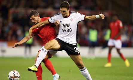 João Palhinha competes for the ball against Remo Freuler of Nottingham Forest.
