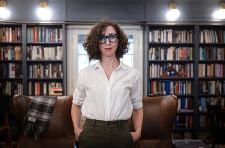 Brooke Nevils poses in a home library