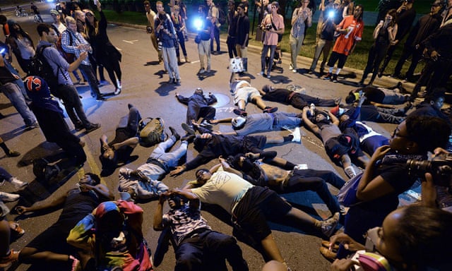 Protesters block the road in front of Bank of America stadium in Charlotte, North Carolina, on Thursday.