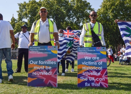 Two men protest during the legislative scrutiny of the nationality and borders bill in 2021.