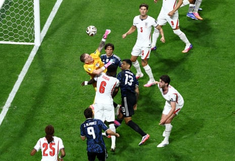 England's Jordan Pickford gets shoved by Argentina's Giuliano Simeone.