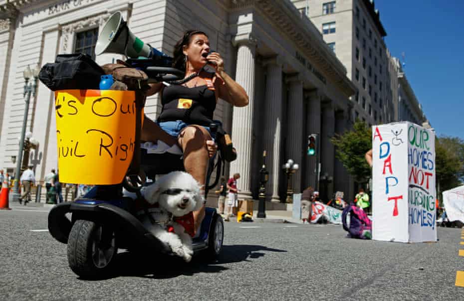 Roxan Perez and her service dog Max join a 2010 protest in Washington, DC