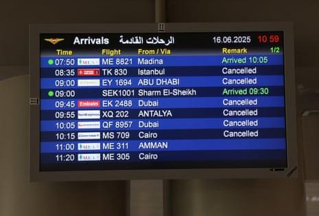 A flight information board showing cancelled flights.