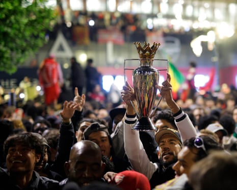 Fans of Arsenal celebrate as Arsenal are confirmed as Premier League champions.