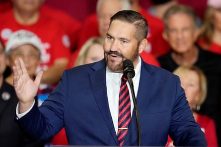 a man in front of a microphone