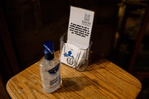 Hand sanitiser and tokens to mark seating positions are provided for members of the congregation at the entrance to the quire of Ripon Cathedral