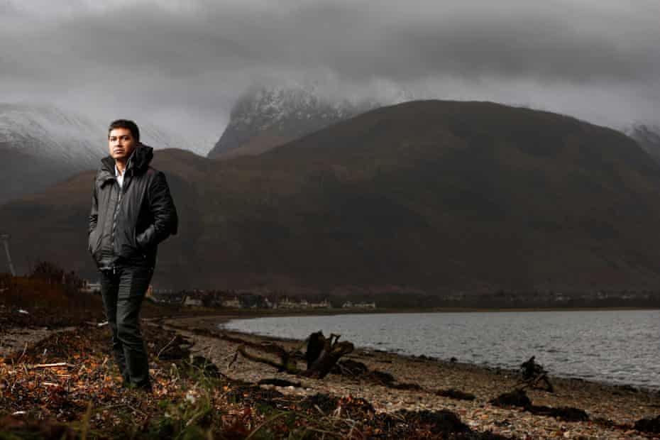 Abul Kamal Azad, a Bangladeshi man trafficked to Scotland (on the shore at Loch Linnhe with Fort William beyond)