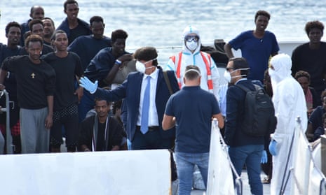 Luigi Patronaggio waits to board the migrant ship Diciotti in Catania