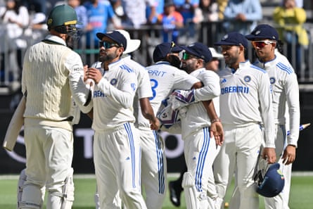 Virat Kohli shakes hands with Australia's Josh Hazlewood at the end of the match.