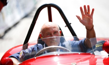 Stirling Moss waves to spectators from his 1955 Ferrari 750 Monza during the Ennstal Classic rally in Austria, 2013.