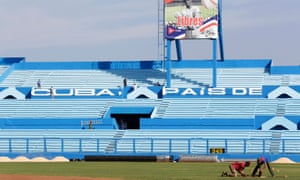 Workers at the Latinoamericano baseball stadium prepare for the game between the Cuban national team and the Tampa Bay Rays.