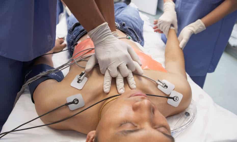 Doctor performing CPR on patient