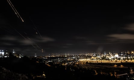 Rockets fired from Iran are seen in the skies over Jerusalem